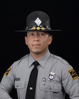Trooper Y. Campos in uniform and campaign hat.